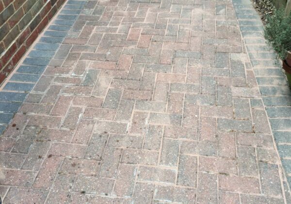 The block paving clean, with its colour back.