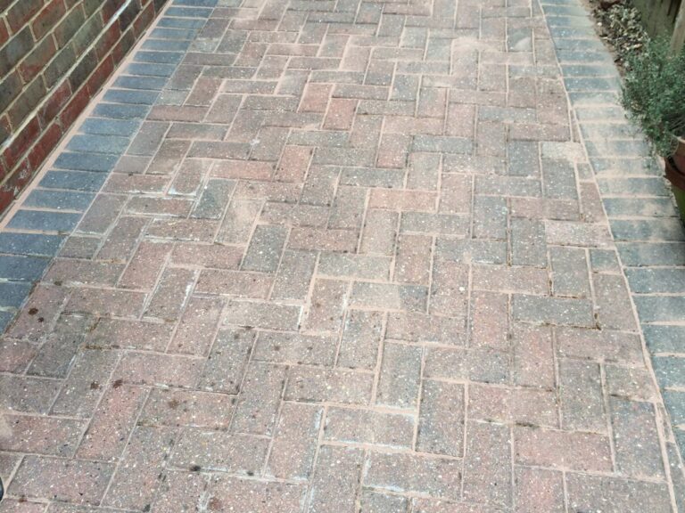 The block paving clean, with its colour back.
