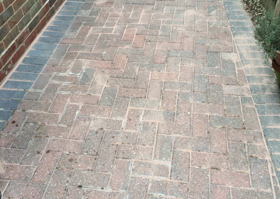 The block paving clean, with its colour back.