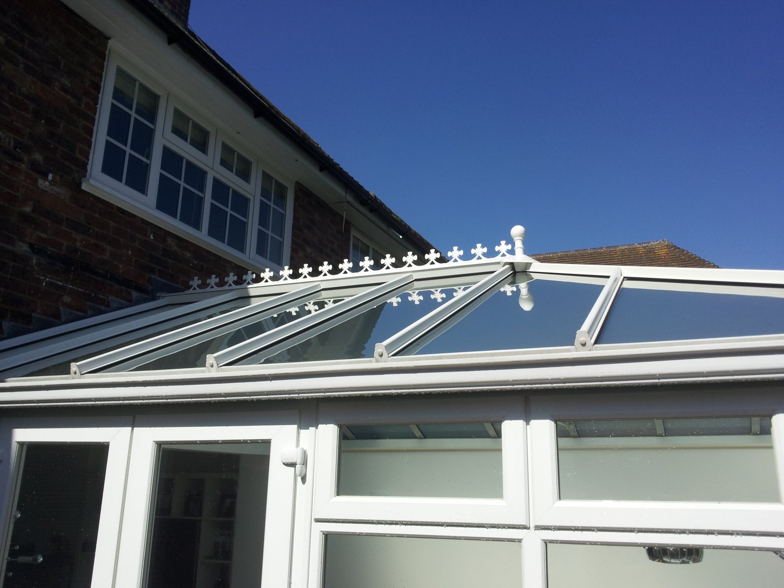 After: crystal-clear panels with daylight flooding back into the room.