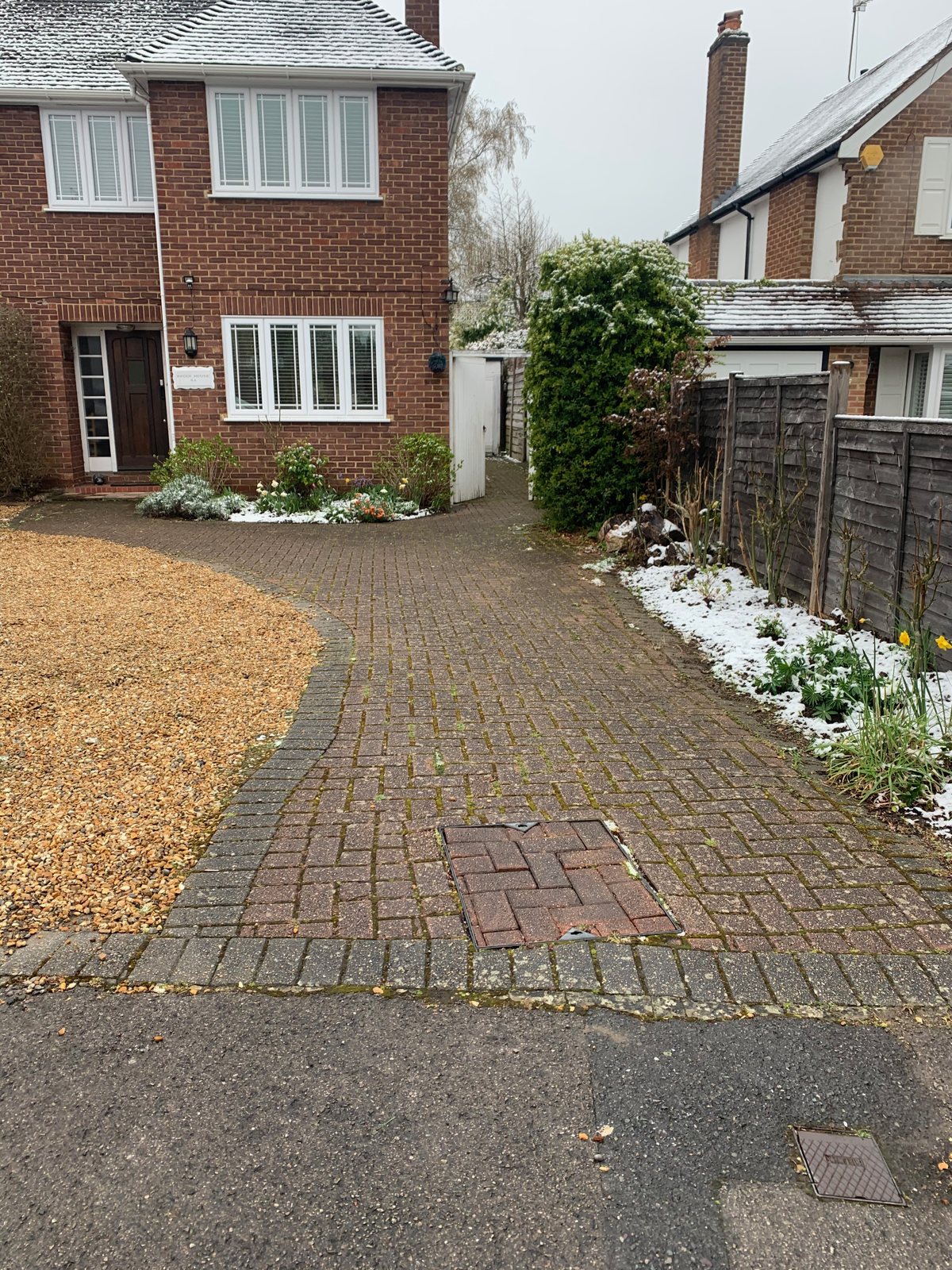 Dirty block paving driveway before cleaning in Woking, Surrey