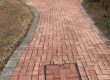 Freshly cleaned brick driveway path in Woking, Surrey