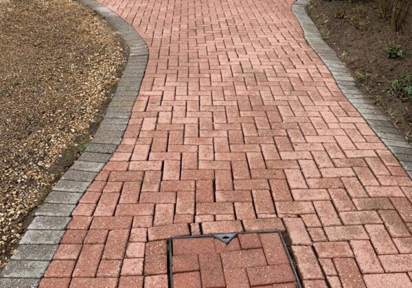 Freshly cleaned brick driveway path in Woking, Surrey