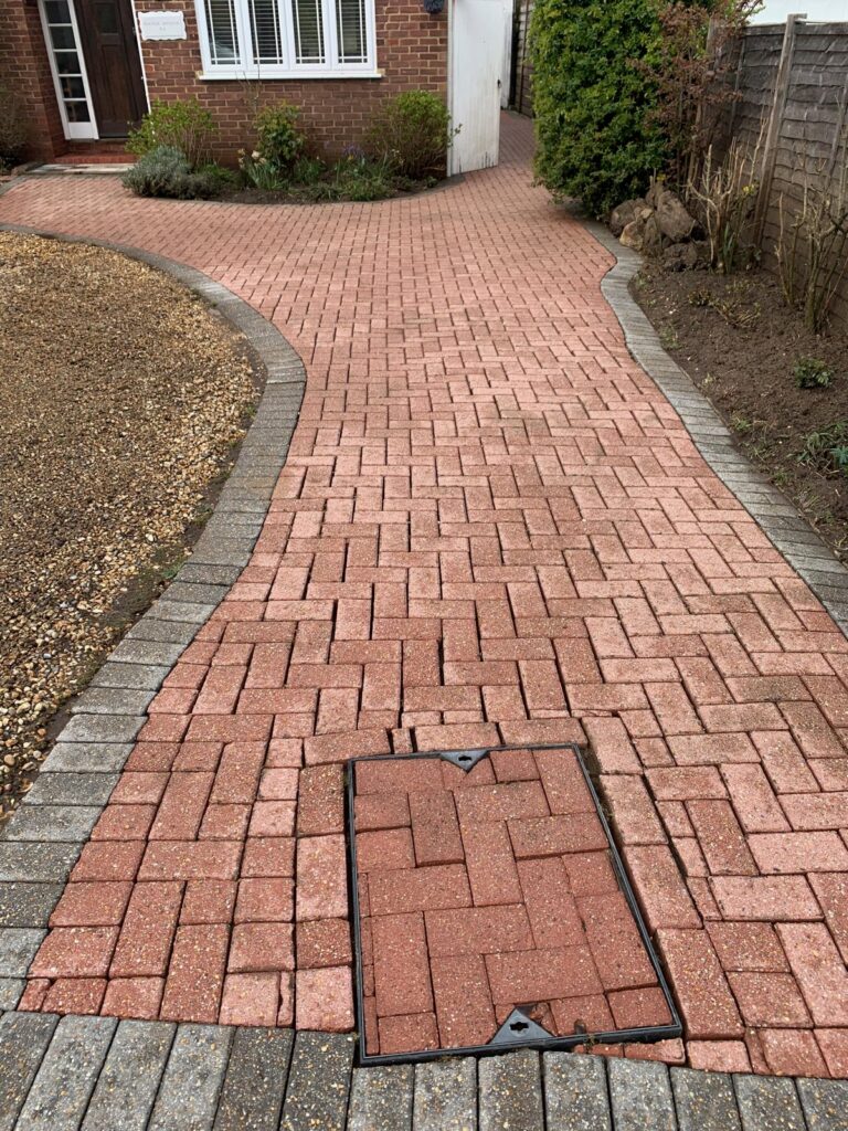 Freshly cleaned brick driveway path in Woking, Surrey