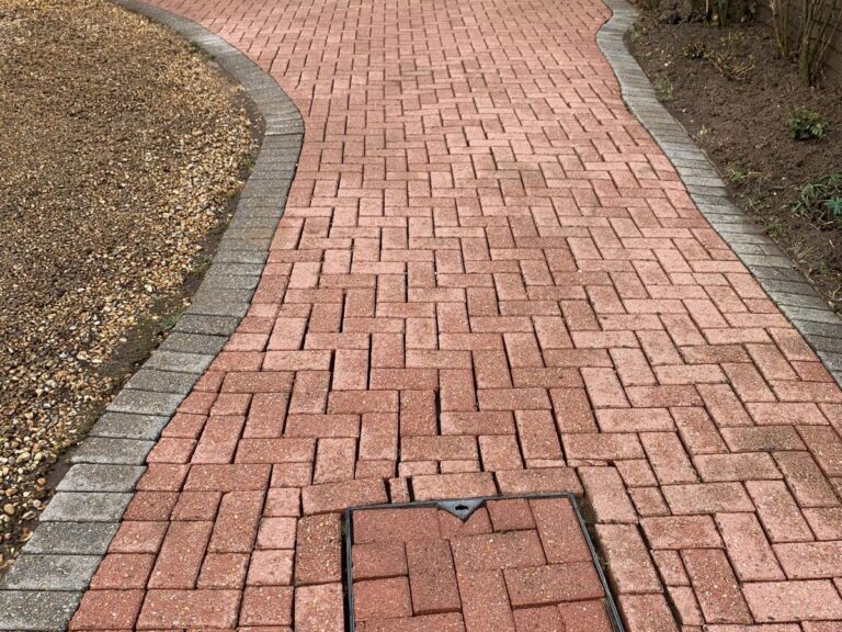Freshly cleaned brick driveway path in Woking, Surrey