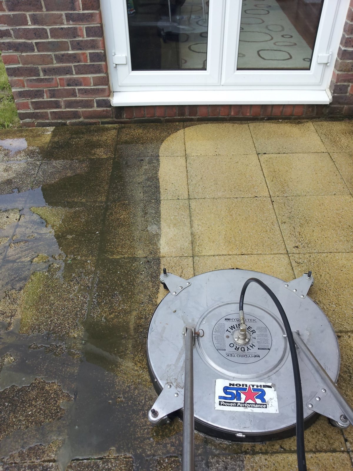Cleaning in progress with a rotary surface cleaner for an even finish.
