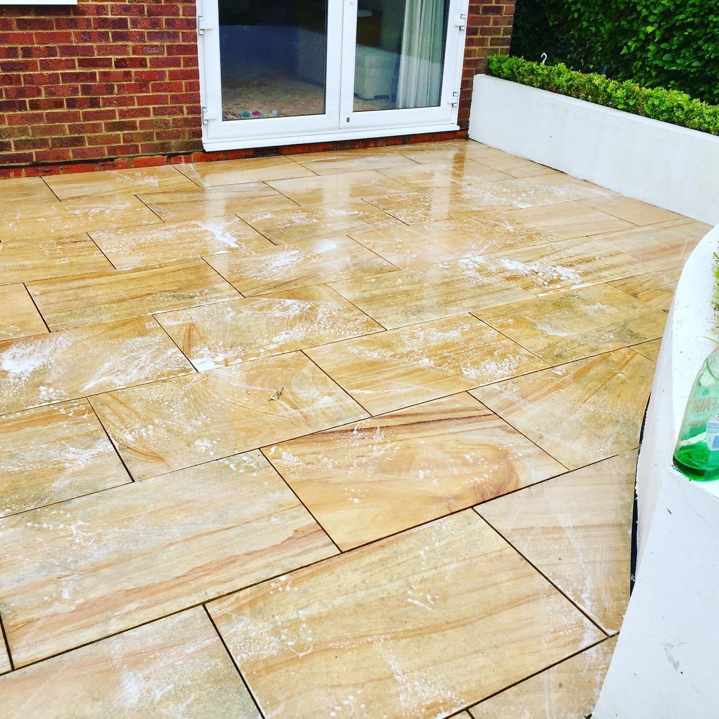 The same patio once it had been washed and treated.