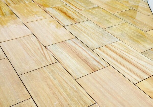 Restored sandstone patio slabs in Woking, Surrey