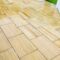 Restored sandstone patio slabs in Woking, Surrey
