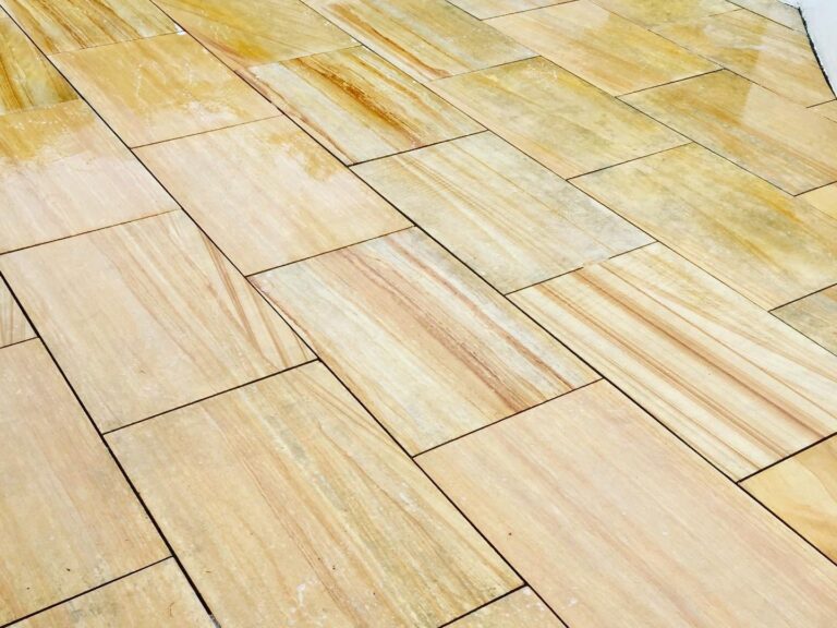 Restored sandstone patio slabs in Woking, Surrey