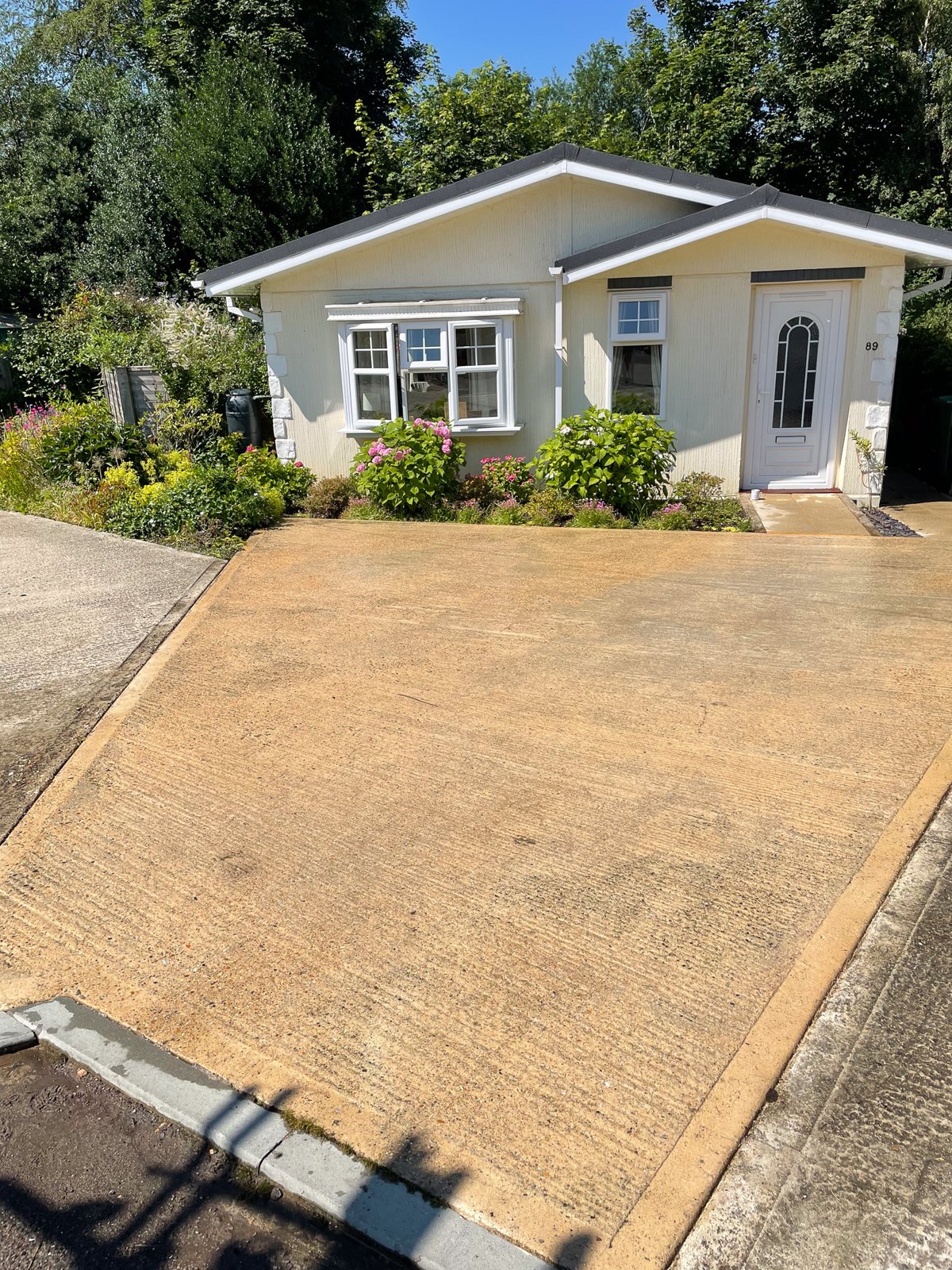 Patio and driveway cleaned at Box Hill Surrey — bungalow with clean forecourt