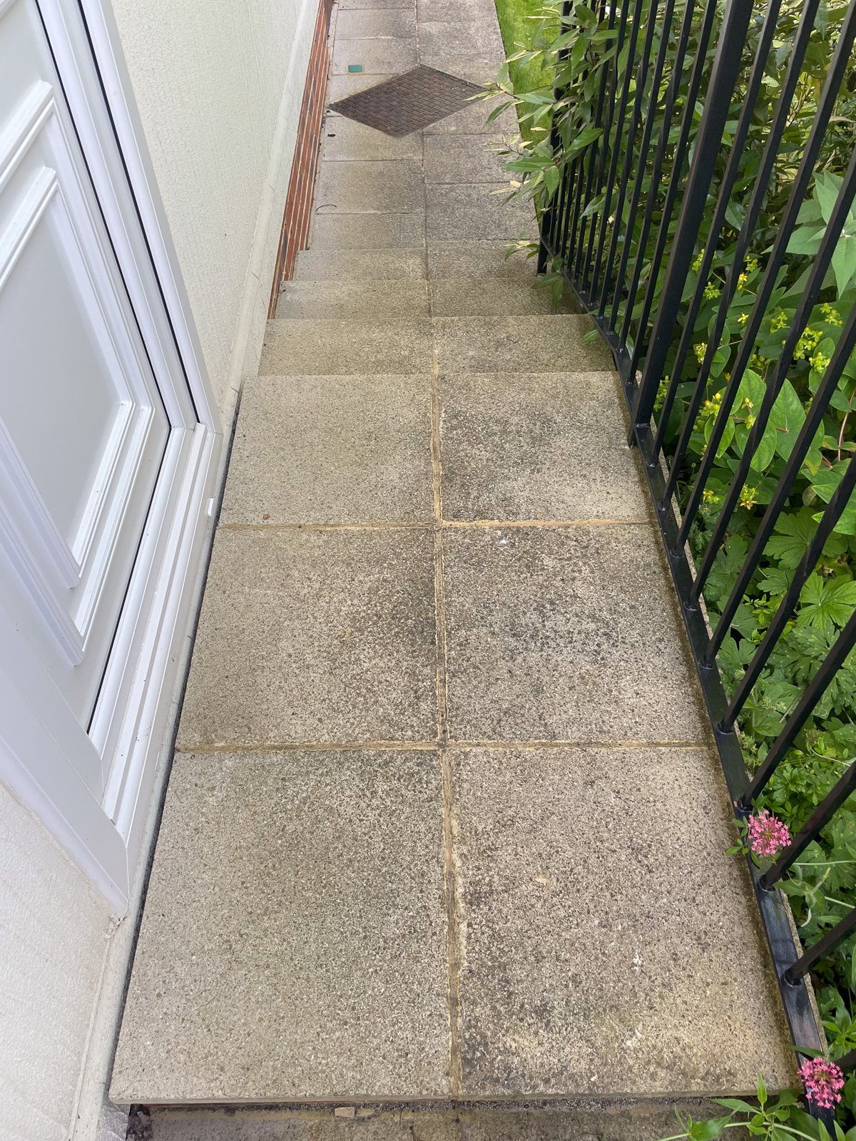 Dirty stained path and patio before cleaning at Box Hill Surrey