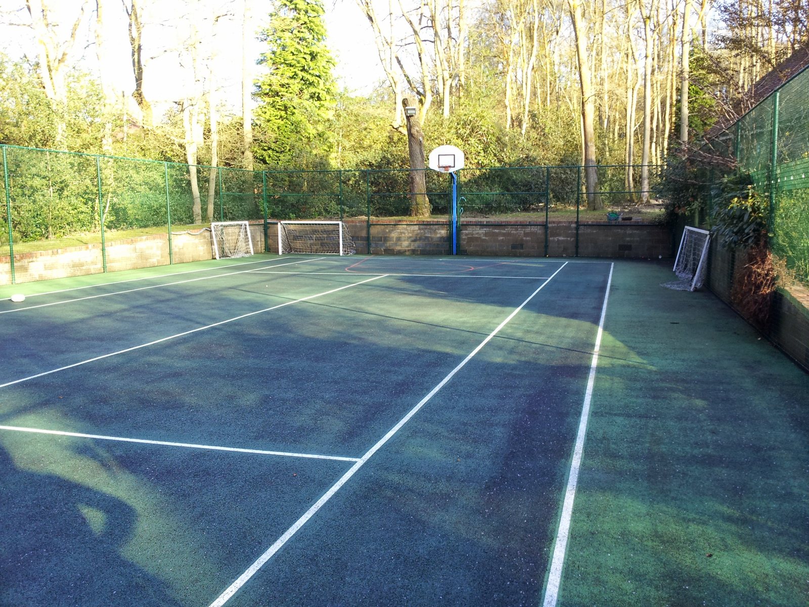 After: a clean court with the lines and grip restored.