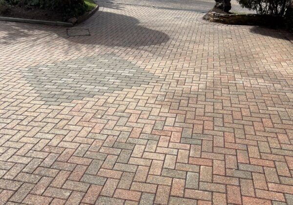 The block paving washed and re-sanded.
