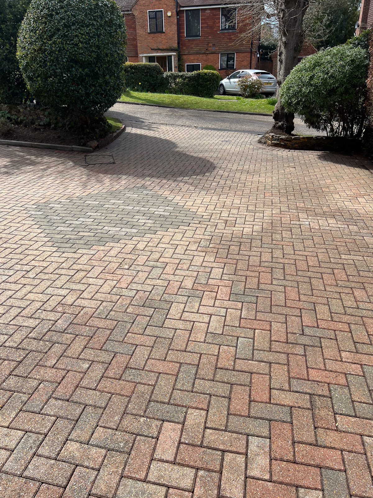 The block paving washed and re-sanded.