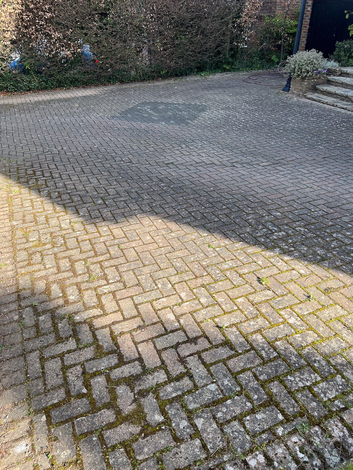 The block paving faded to grey.