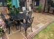The sandstone patio cleaned and treated.