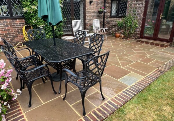 The sandstone patio cleaned and treated.