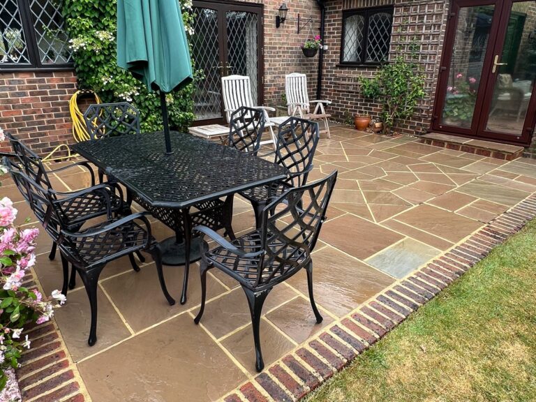 The sandstone patio cleaned and treated.