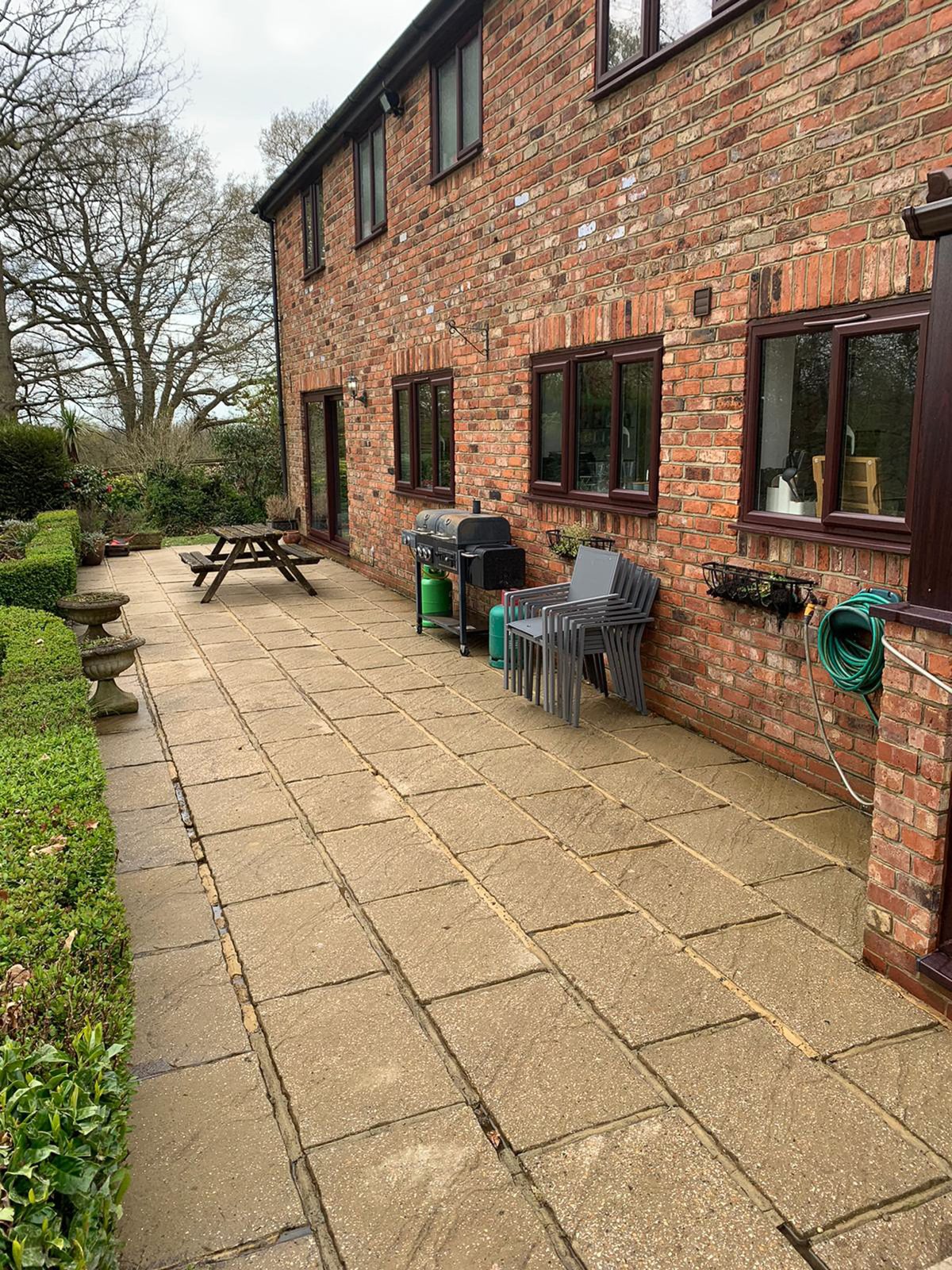 The paths and patio cleaned.