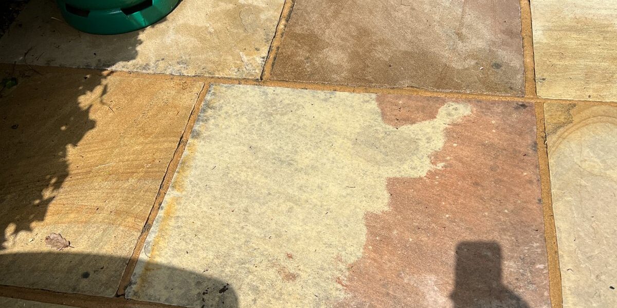 The sandstone patio cleaned.