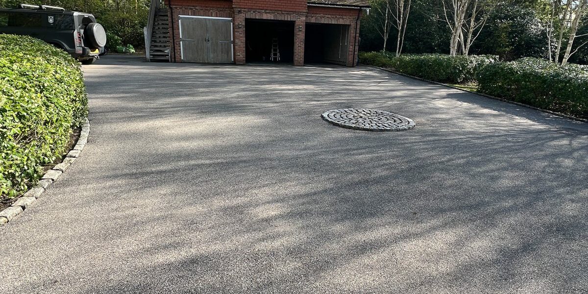 The tarmac driveway cleaned.