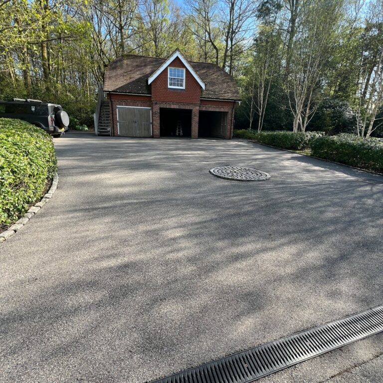 The tarmac driveway cleaned.