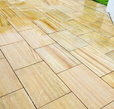 Restored sandstone patio slabs in Woking, Surrey